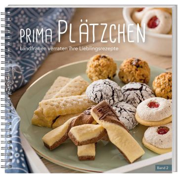 Ein spiralgebundenes Backbuch mit dem Titel „Prima Plätzchen – Landfrauen verraten ihre Lieblingsrezepte, Band 2“. Auf dem Cover sind verschiedene Plätzchen auf einem Teller arrangiert, darunter Schokocookies, Kokosmakronen und Buttergebäck.