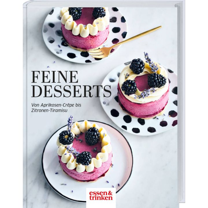 Buchcover: "Feine Desserts". Drei Himbeertörtchen mit Brombeeren und Sahne auf gepunkteten Tellern, verziert mit Lavendel. Text: "Von Aprikosen-Crêpe bis Zitronen-Tiramisu". Logo: essen & trinken.